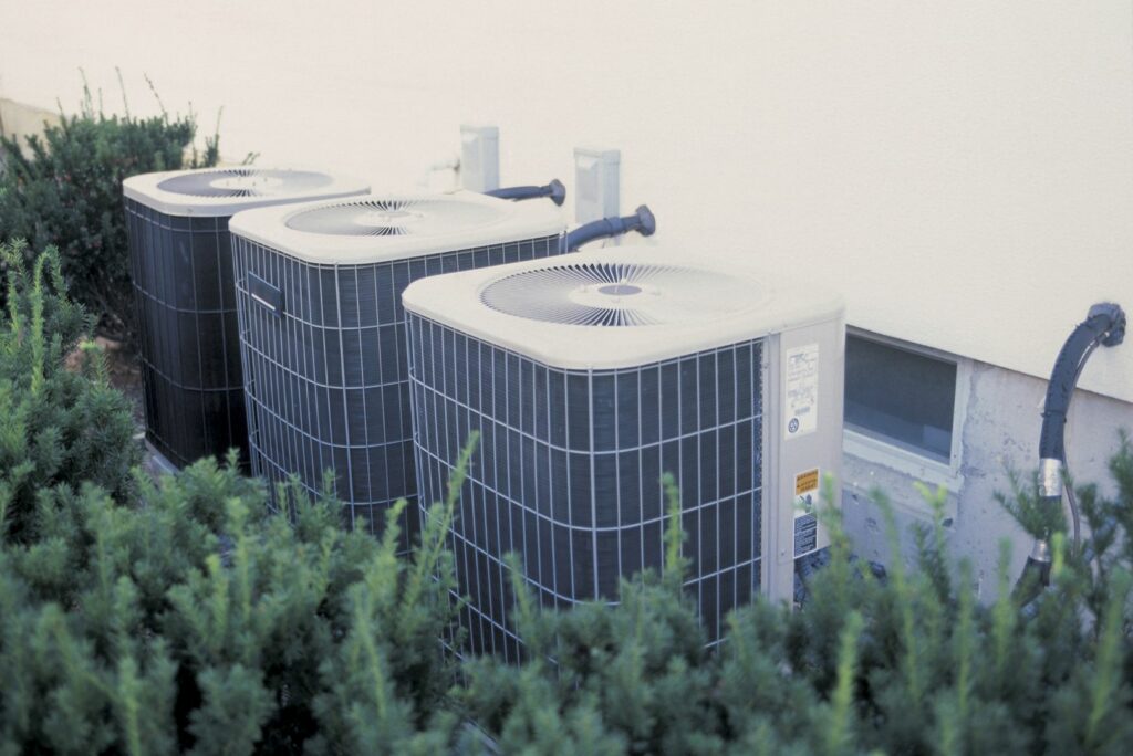 Multiple Air conditioner units side by side outside a building