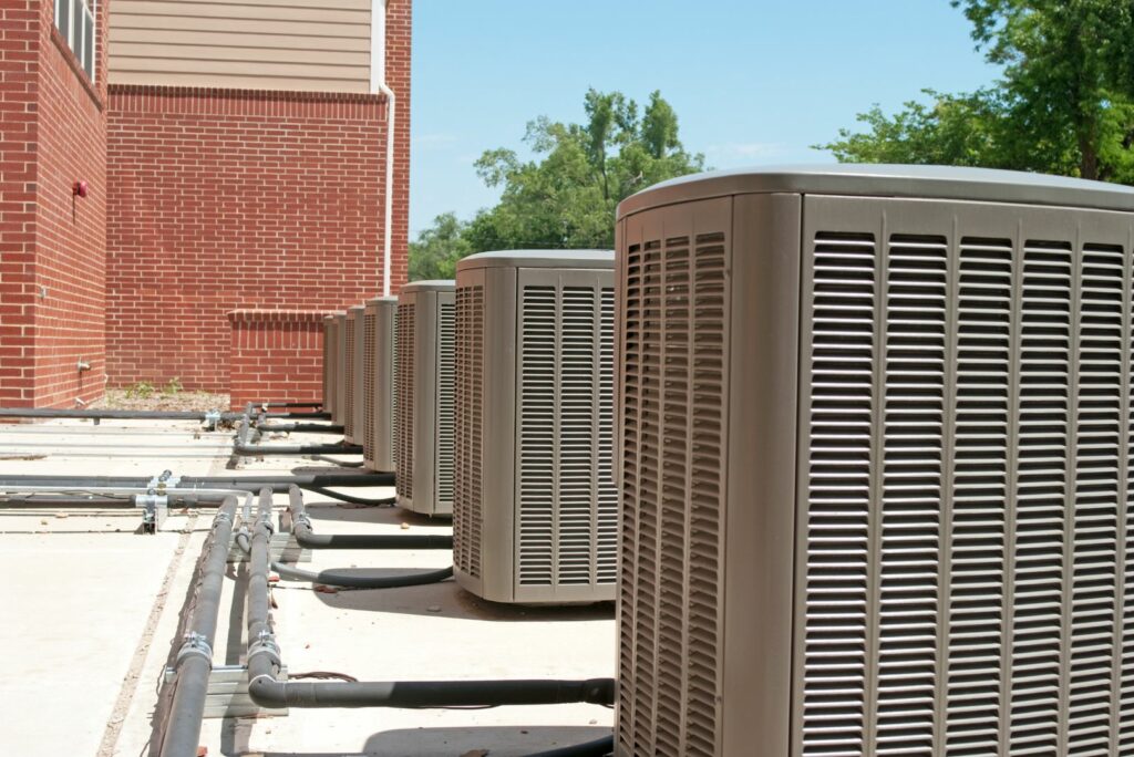 lined up air conditioners plumbed together for larger building.